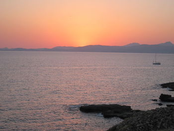 Scenic view of sea against clear sky during sunset