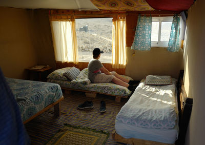 Boy relaxing on bed at home