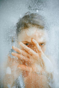 Close-up portrait of woman in water