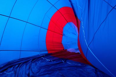 Close-up of hot air balloon against blue wall