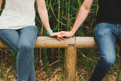 Low section of people sitting outdoors