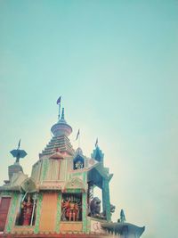 Low angle view of hindu temple against clear sky
