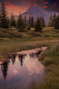 Scenic view of lake against sky during sunset