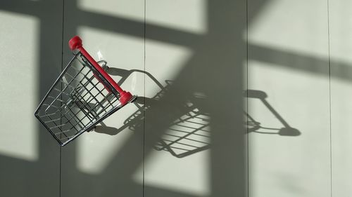 Shopping cart left alone, trolley's shadow, panic buying
