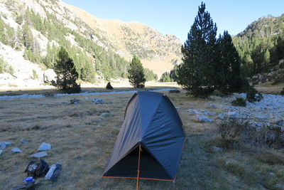 Scenic view of tent on mountain against sky