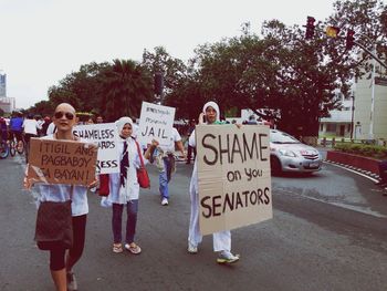 Woman walking on road