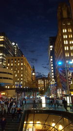 Illuminated buildings in city at night