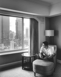 Man sitting on chair at home