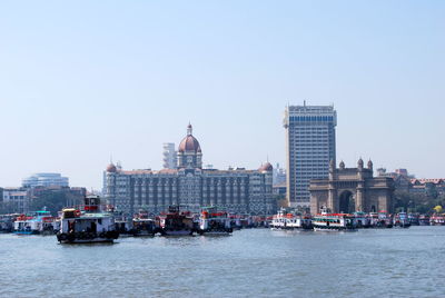 Tourboats moored in front of the taj hotel at mumbai