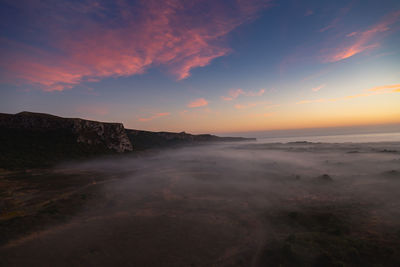 Scenic view of sea against sky during sunrise