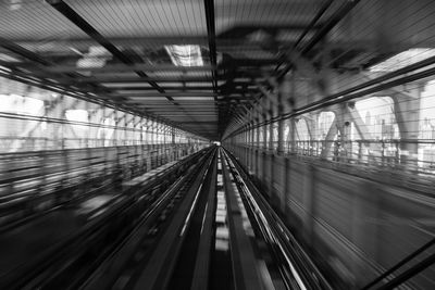 Blurred motion of illuminated railroad station