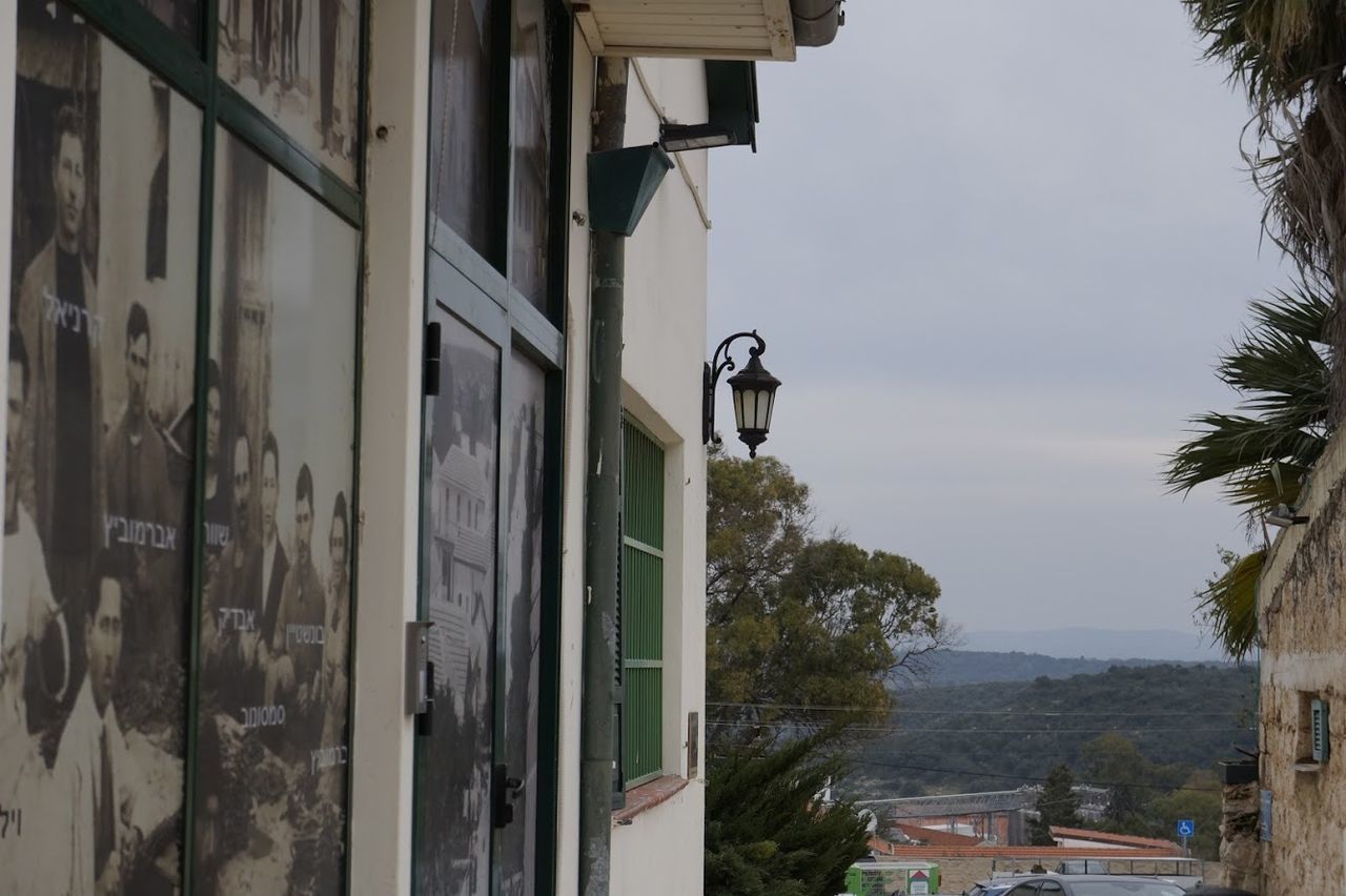 BUILDINGS AND STREET AGAINST SKY