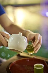 Close-up of hand holding tea cup