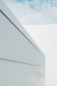 Low angle view of white oslo opera house against sky