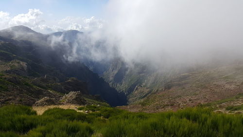 Scenic view of mountains during foggy weather