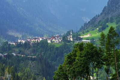 Scenic view of townscape and mountains