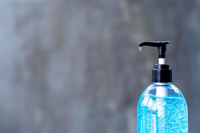 Close-up of glass bottle on water