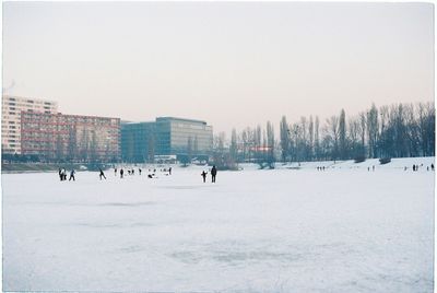 People on snow covered lake