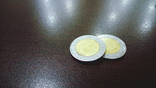 High angle view of coins on table