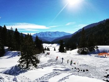 Scenic view of snow covered mountains against sky