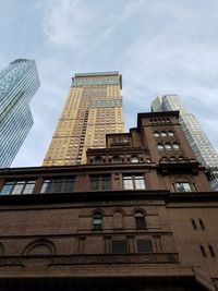 Low angle view of modern buildings against sky