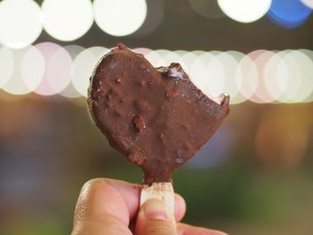Close-up of hand holding ice cream