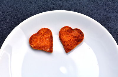 High angle view of heart shape in plate on table