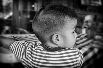 Close-up of boy sitting at table