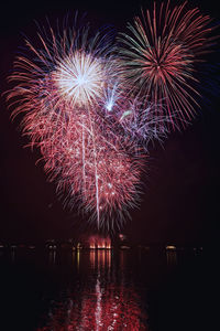 Low angle view of firework display at night