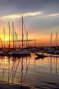 Boats moored at harbor