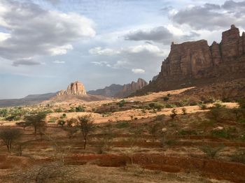 Panoramic view of landscape against cloudy sky