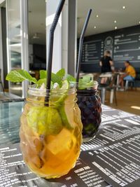 Close-up of drink in glass jar on table