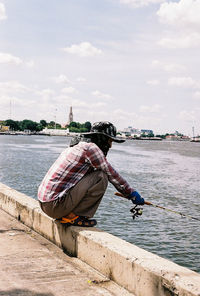 Full length of man fishing in sea