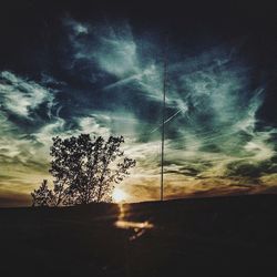 Scenic view of landscape against sky at sunset