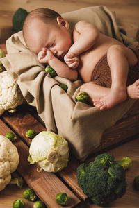 High angle view of cute baby on table