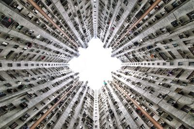 Low angle view of illuminated lights hanging from ceiling in building