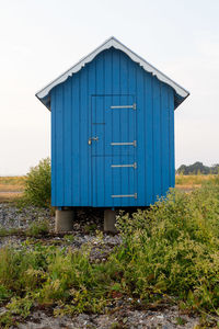 House on field against sky