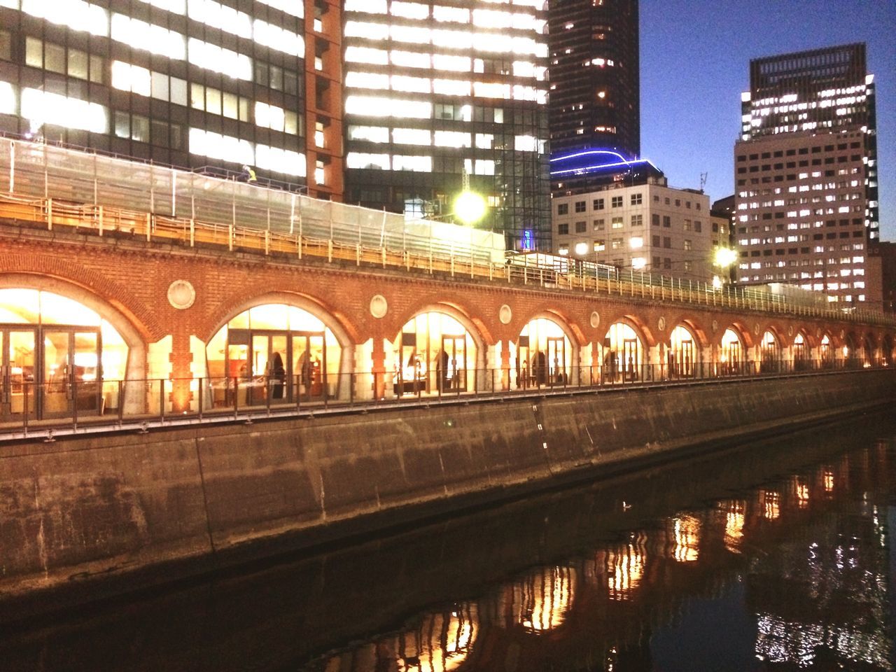 architecture, built structure, building exterior, city, reflection, illuminated, transportation, water, city life, building, canal, incidental people, connection, night, outdoors, bridge - man made structure, travel destinations, river, street light, residential building