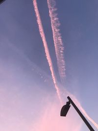 Low angle view of vapor trail against sky