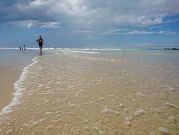 Scenic view of beach against sky