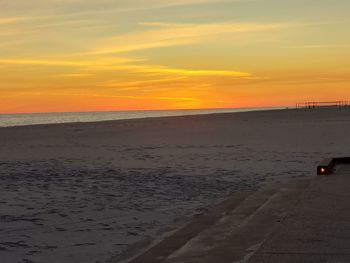 Scenic view of beach against sky during sunset