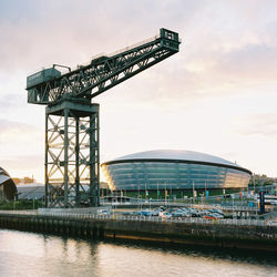 View of cranes against sky