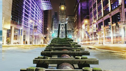 Illuminated modern buildings in city at night