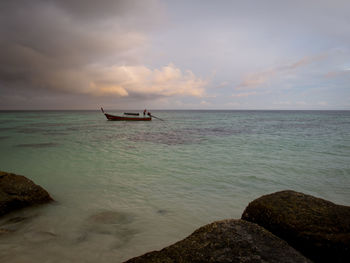 Scenic view of sea against cloudy sky