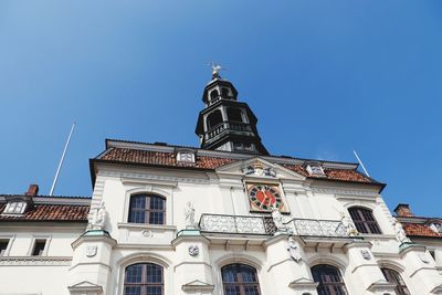 Low angle view of building against clear blue sky