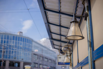 Low angle view of illuminated lights hanging from ceiling
