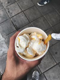 Midsection of person holding ice cream