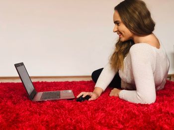 Rear view of woman using mobile phone