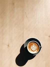 High angle view of cappuccino on table