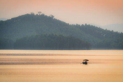 Scenic view of landscape against sky during sunset